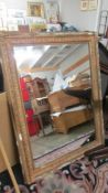 An old gilt framed mirror, frame a/f.