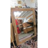 An old gilt framed mirror, frame a/f.