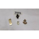 Four items of 9ct gold being an anchor, an ingot, a ring and a letter C pendant, 4.4 grams.