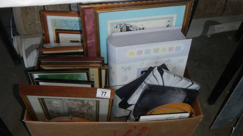 A large box of assorted pictures.