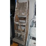 Two wooden step ladders.