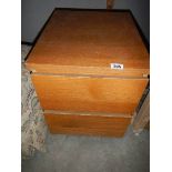 A two drawer filing cabinet.