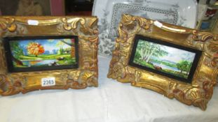 A pair of oil on copper colourful landscape scenes in ornate gilt frames.