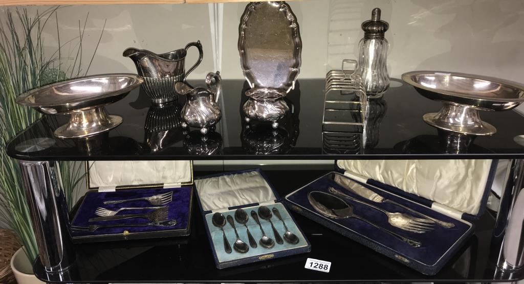 A quantity of silver plate including milk jug, sugar bowl, toast rack etc.