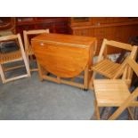 A pine kitchen table and 4 chairs.