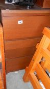 A three drawer mahogany chest.