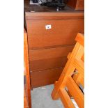 A three drawer mahogany chest.