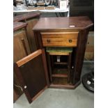 A dark wood stained cupboard with drawer & stool