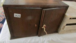 An early 20th century oak insect specimen cabinet (contents in poor condition).