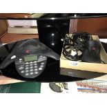 A Polycom Soundstation 2 conference phone with accessories