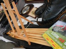 A wooden artist's easel in case.