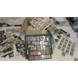 A box of assorted foreign stamps including Nicaragua, France, South Africa, Bhutan, Morocco,