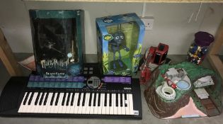 A quantity of assorted toys including Tracy Island, Harry Potter, Death eater mash,
