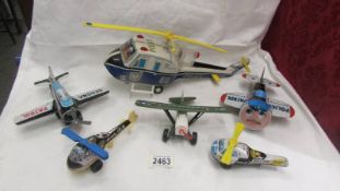 A selection of Japanese tin plate police airplanes and helicopters including large 'TN' Japan