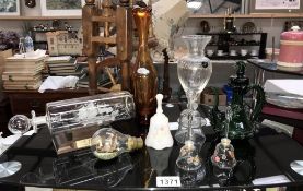 A selection of glass ware including ship in bottle & light bulb, bells,