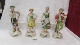 A set of four Goebel figurines.