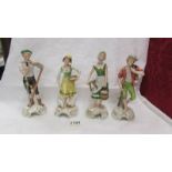 A set of four Goebel figurines.