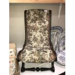 A Victorian nursing chair (recovered & missing brass to embellishment 1 side)