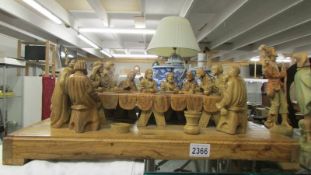 An olive wood carving of the last supper.