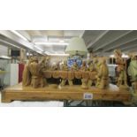 An olive wood carving of the last supper.