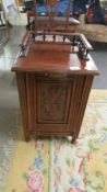 A mahogany bedside cabinet.