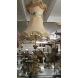 A good quality heavy brass table lamp with good quality fringed shade.