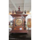 An 8 day striking mantel clock.