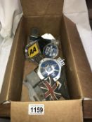 A box of badges etc.