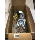 A box of badges etc.