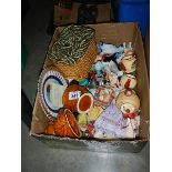 A box of ceramic collectables.