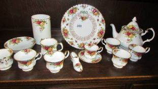 Six Royal Albert old country roses tea cups, a teapot, a coffee cup with saucers, utensil jar etc.