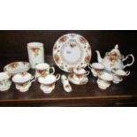 Six Royal Albert old country roses tea cups, a teapot, a coffee cup with saucers, utensil jar etc.