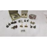 A good lot of cuff links, tie clips, silver ring and bangle.