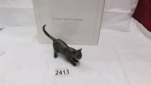 A boxed Richard Cooper & Company, art in bronze, limited edition crouching cat, 95/100.
