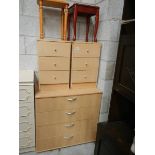 A pair of three drawer bedsides, a four drawer bedside and two side tables.