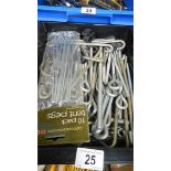 A quantity of tent pegs etc.