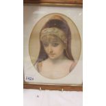 A Victorian framed and glazed portrait print of a young lady.