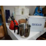 A quantity of metal kitchen ware.