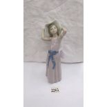 A boxed Lladro figure of a girl (missing parasol).