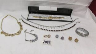 A mixed lot of sparkly necklaces, bracelet and earrings.