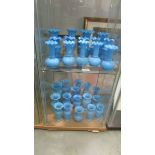 Approximately 30 blue glass vases in various styles, (2 shelves). (Collect only).