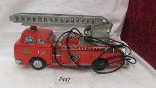 A Japanese tin plate fire engine by Modern Toys, Made in Japan.