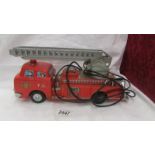 A Japanese tin plate fire engine by Modern Toys, Made in Japan.