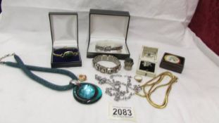 A mixed lot of costume jewellery including bangles, rings, pendant etc.