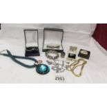 A mixed lot of costume jewellery including bangles, rings, pendant etc.