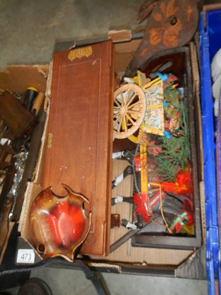 A box of assorted wooden items.