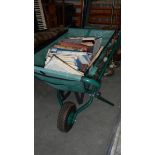 A Garden Tidy fabric wheel barrow full of books.