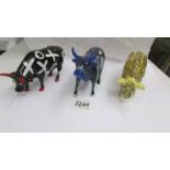 Three boxed Cow Parade cows - Leopard Cow, Party Cow and Oxo Cow.