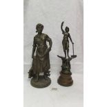 A spelter figure on a wooden base (34 cm) and another spelter figure (33cm).