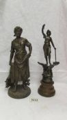 A spelter figure on a wooden base (34 cm) and another spelter figure (33cm).